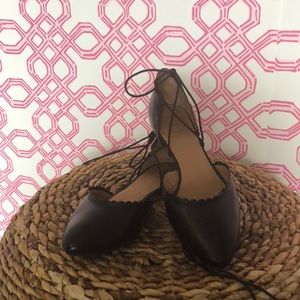 Jack Rogers black lace up flats with scallops